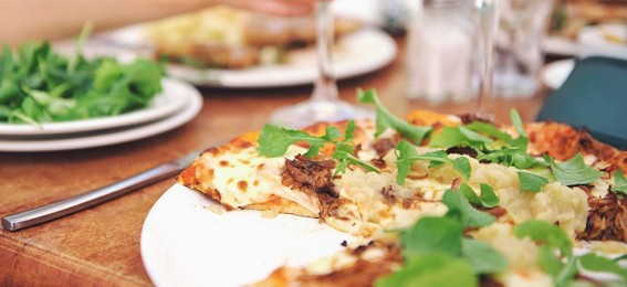 Homemade pizza with fresh coriander